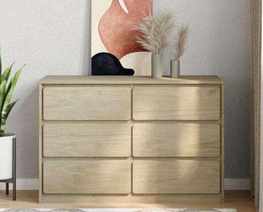 solid pine wood cabinet with 6 drawers against a light grey wall, standing on a wooden floor