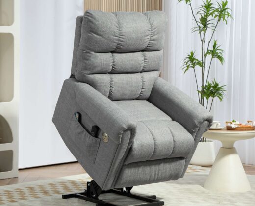 grey power lift recliner chair, half tilted with remote controls in the chair pocket